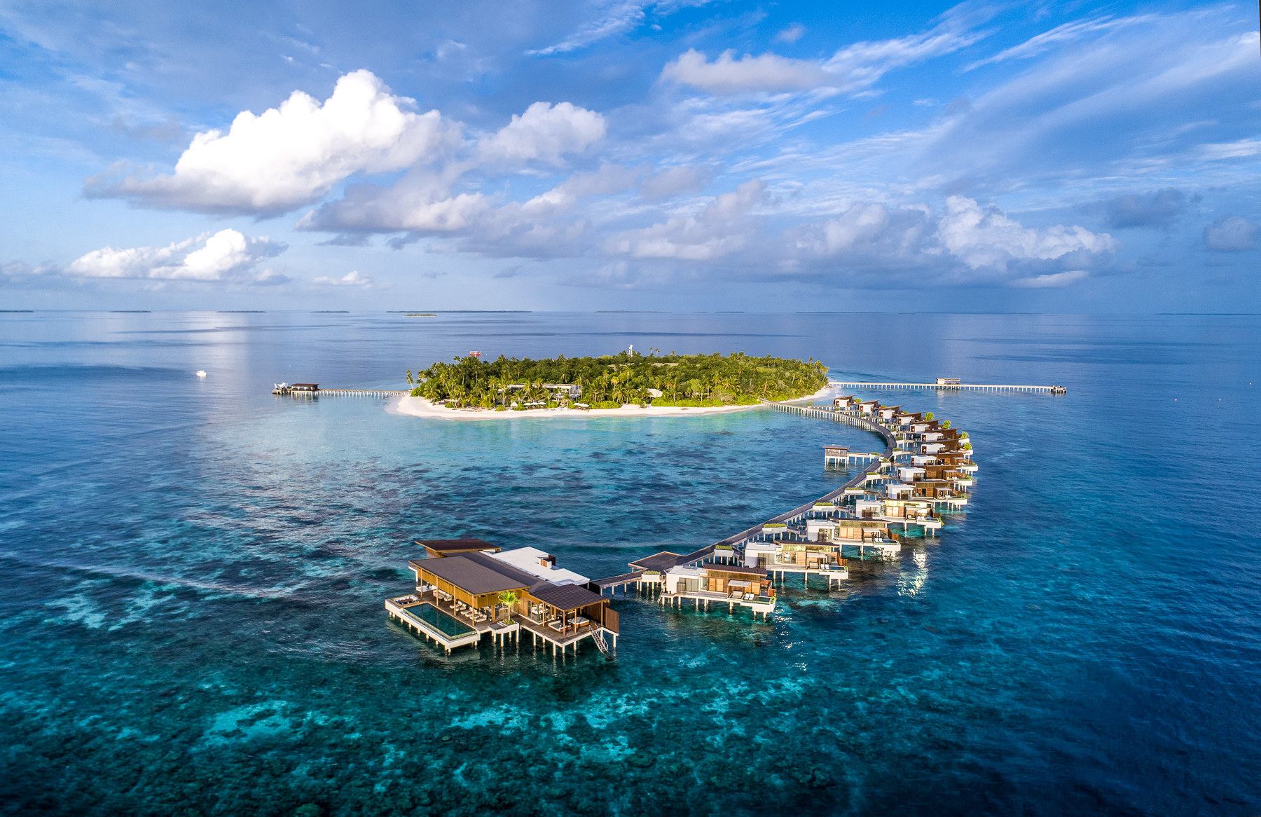 Aerial view of overwater villas at Park Hyatt Maldives Hadahaa