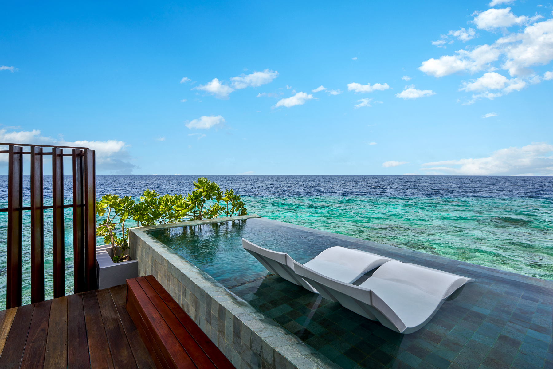 Chairs outside a pool villa at Park Hyatt Maldives Hadahaa
