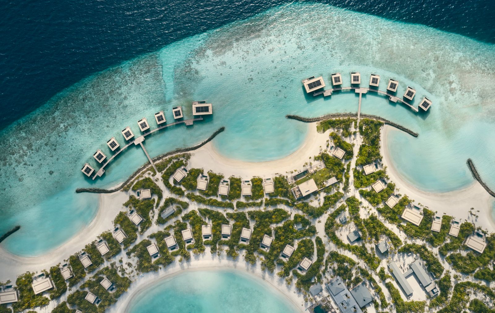 Aerial view of the island of luxury resort Patina in the Maldives