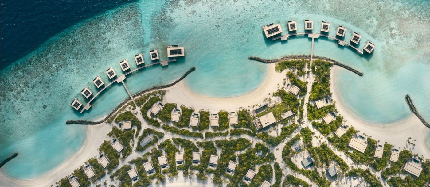 Aerial view of the island of luxury resort Patina in the Maldives