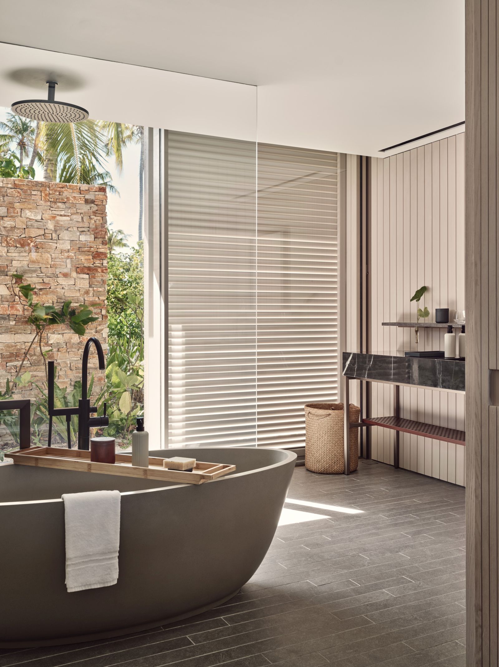 Bathroom with freestanding tub at The Beach House at luxury resort Patina in the Maldives