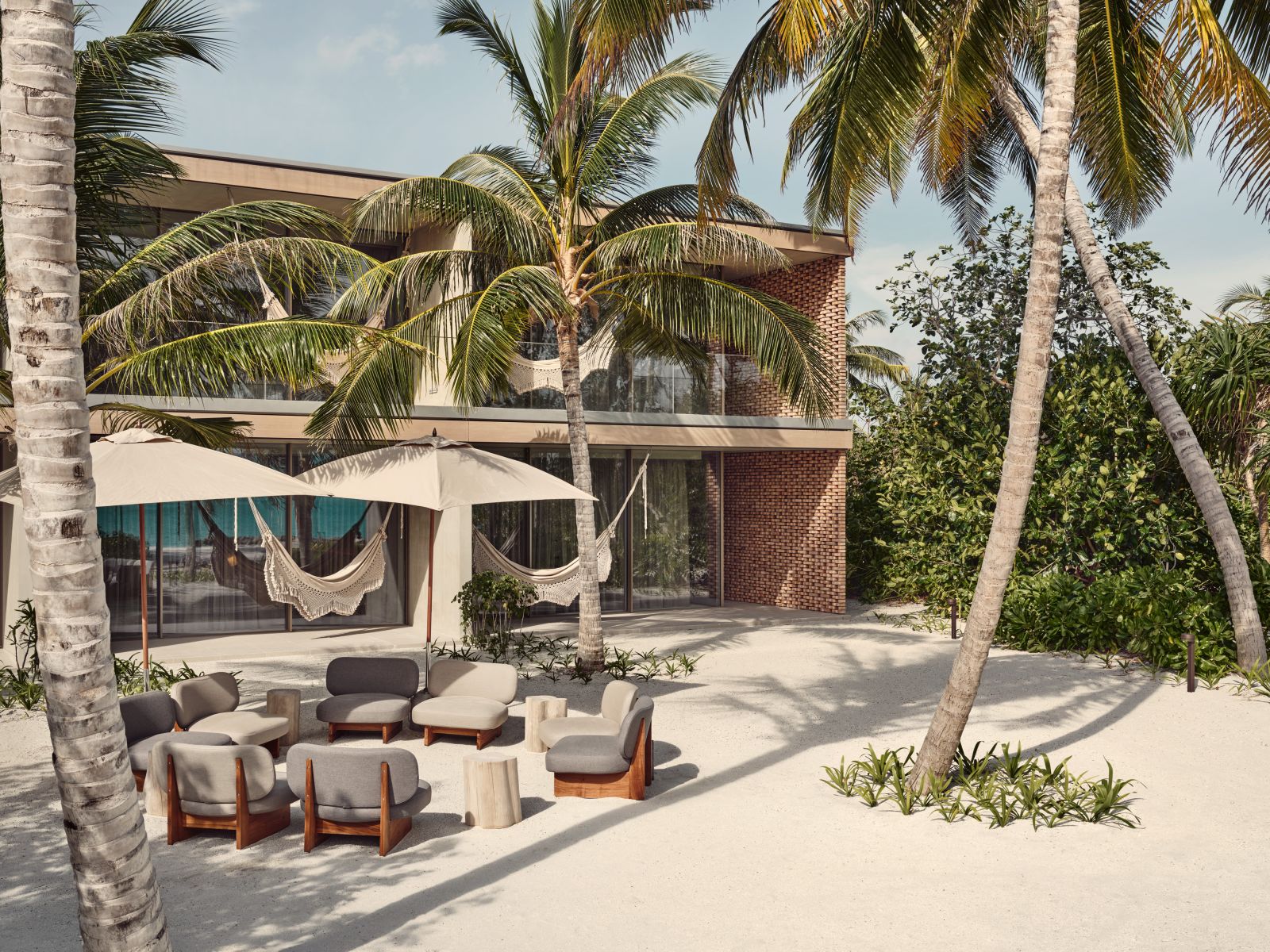 Exterior of Villa Fari, with private seating and hammocks at luxury resort Patina in the Maldives