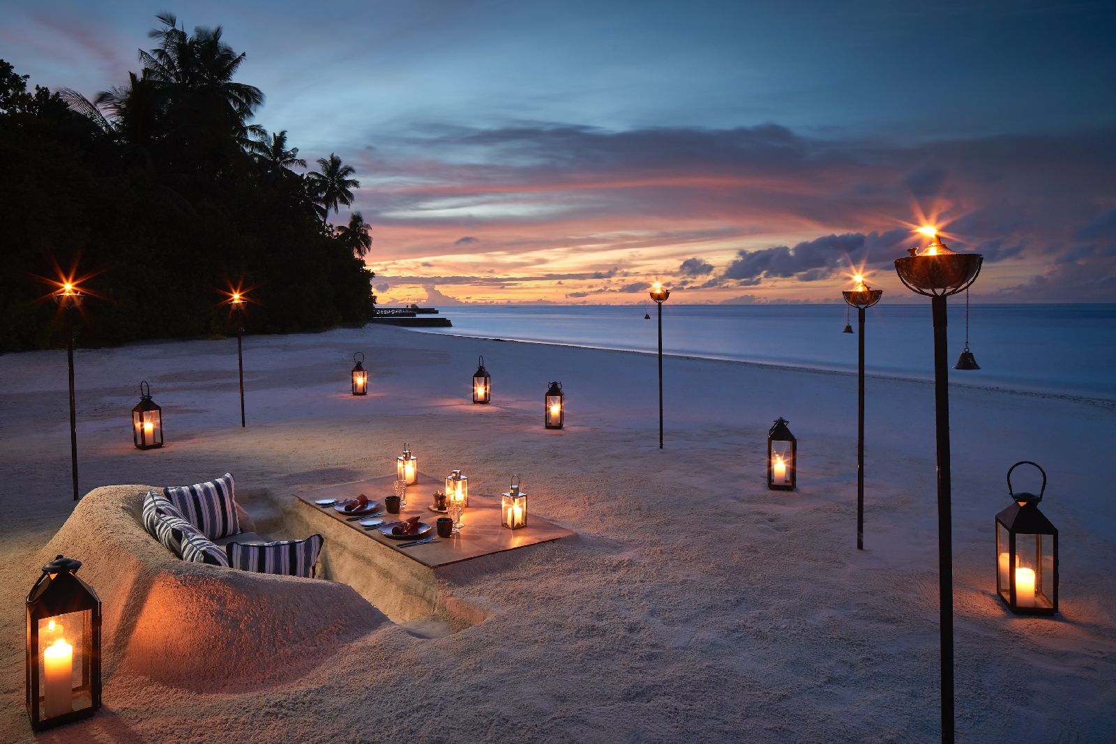 Private dining on the beach at Raffles Maldives Meradhoo