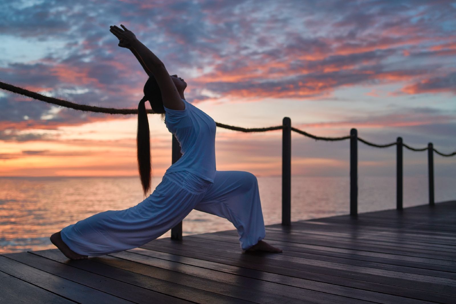 Sunset yoga at the Raffles Maldives Meradhoo