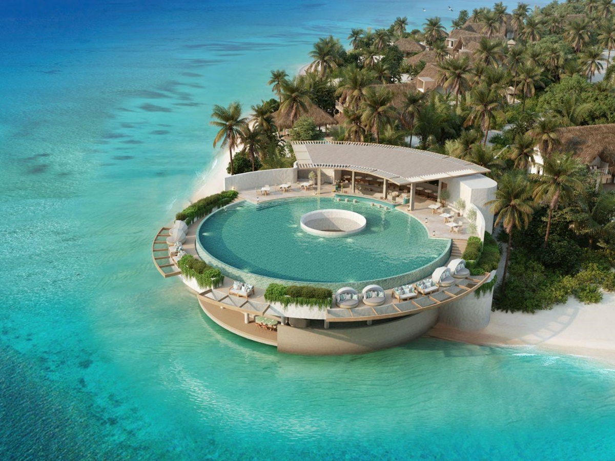 Aerial view of the circular infinity pool at Six Senses Kanuhura Maldives