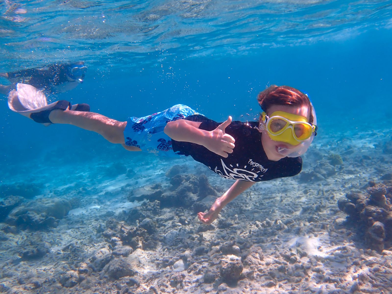 Child snorkelling at Six Senses Laamu in the Maldices