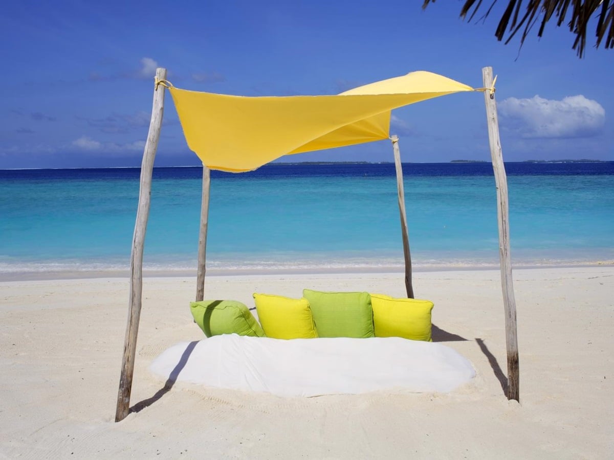 Private Beach Picnic on the white Sand Beach of luxury resort Six Senses Laamu in the Maldives
