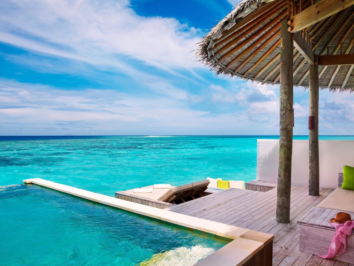 Terrace of a Water Villa with Pool, overlooking the Turquoise Indian Ocean at luxury resort Six Senses Laamu in the Maldives