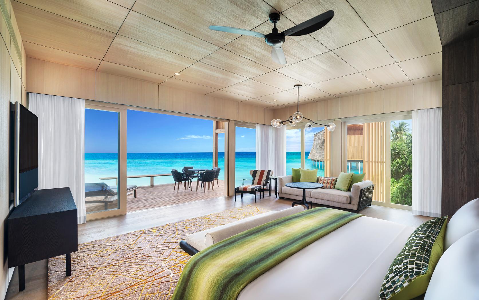 A bedroom of a family pool suite at St Regis Vommuli, Maldives