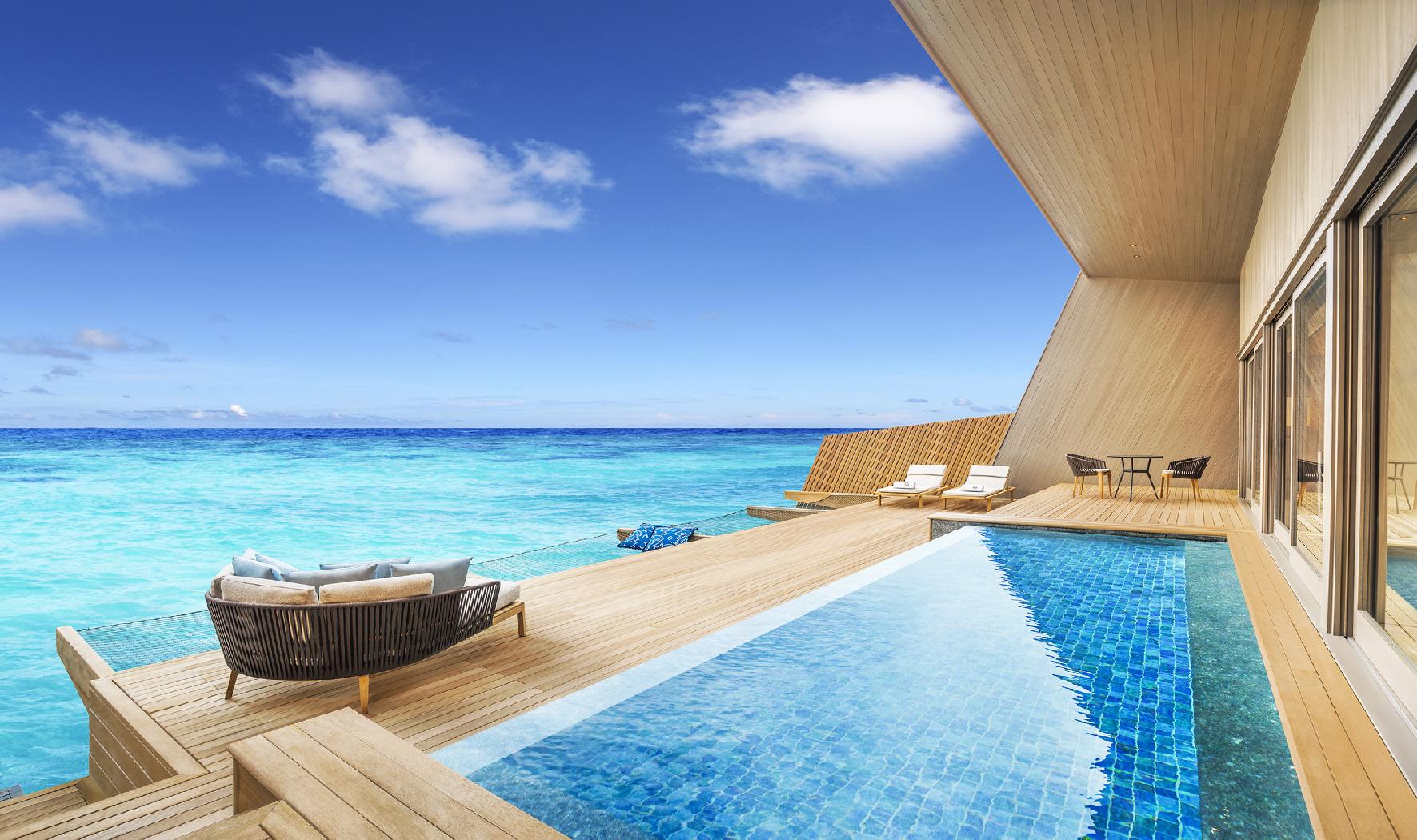 The swimming pool of an overwater villa at St Regis Vommuli, Maldives