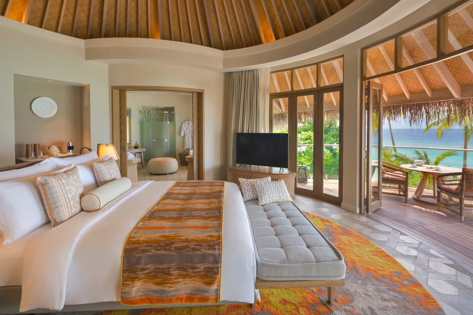 Bedroom of a Beach Residence with ensuite bathroom and private terrace at luxury resort The Nautilus in the Maldives