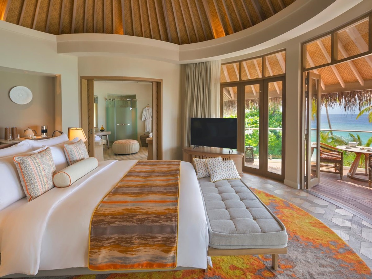 Bedroom of a Beach Residence with ensuite bathroom and private terrace at luxury resort The Nautilus in the Maldives
