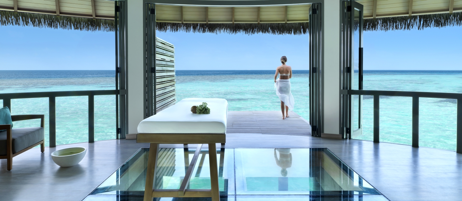 Spa treatment room with deck and panoramic views over the Indian Ocean at luxury resort Vakkaru in the Maldives