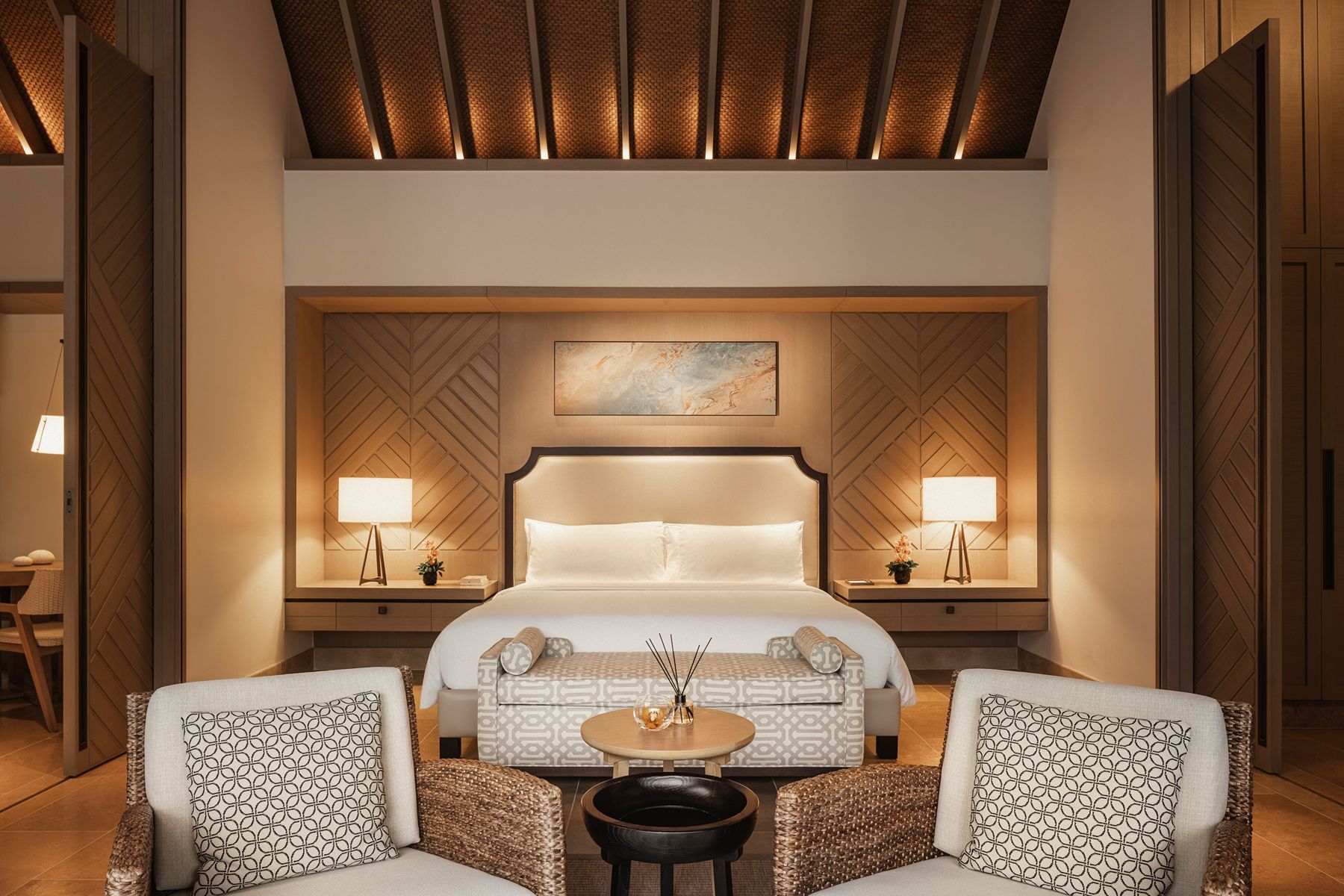 Beach villa bedroom at Waldorf Astoria Maldives Ithaafushi