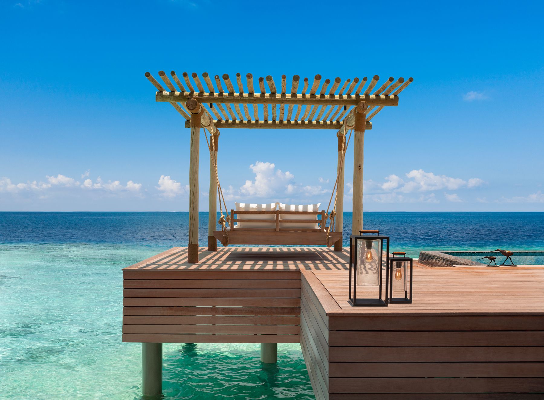Swinging daybed overlooking the ocean at Waldorf Astoria Maldives Ithaafushi