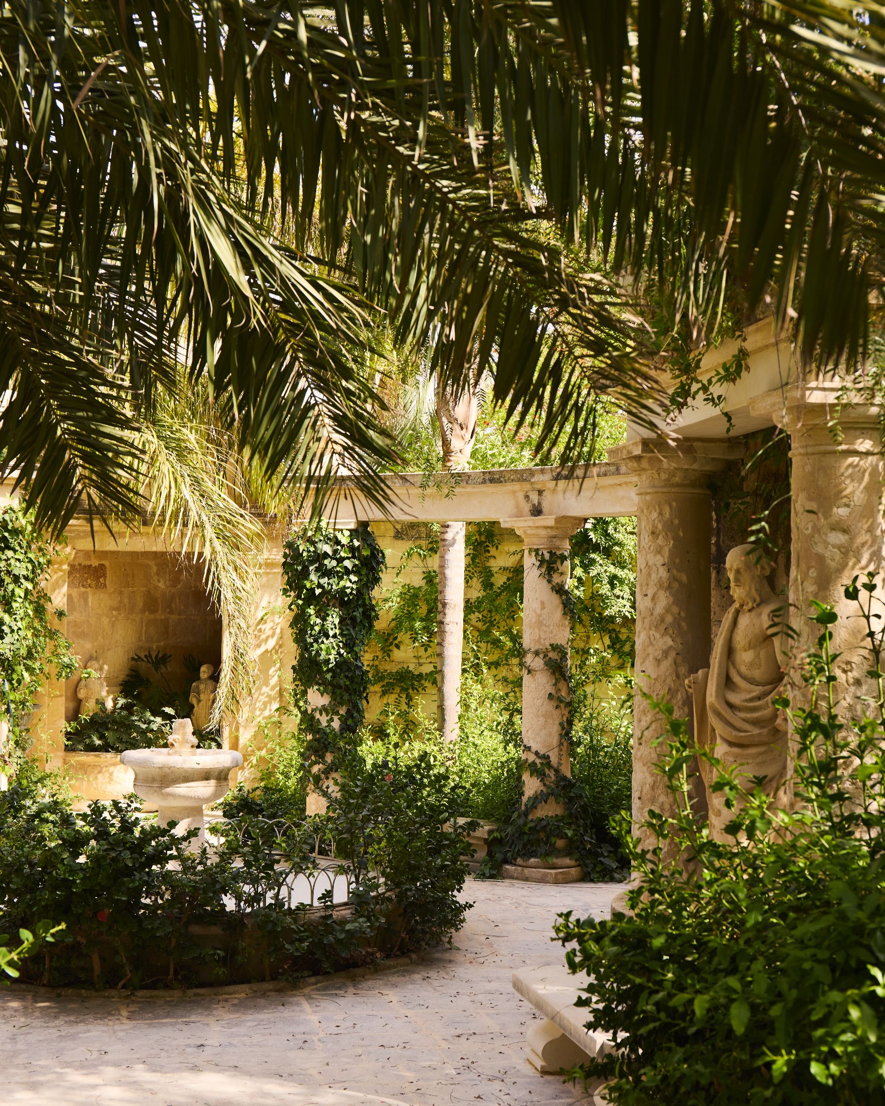 Columns and statues in the gardens at Casa Bonavita hotel in Attard Malta