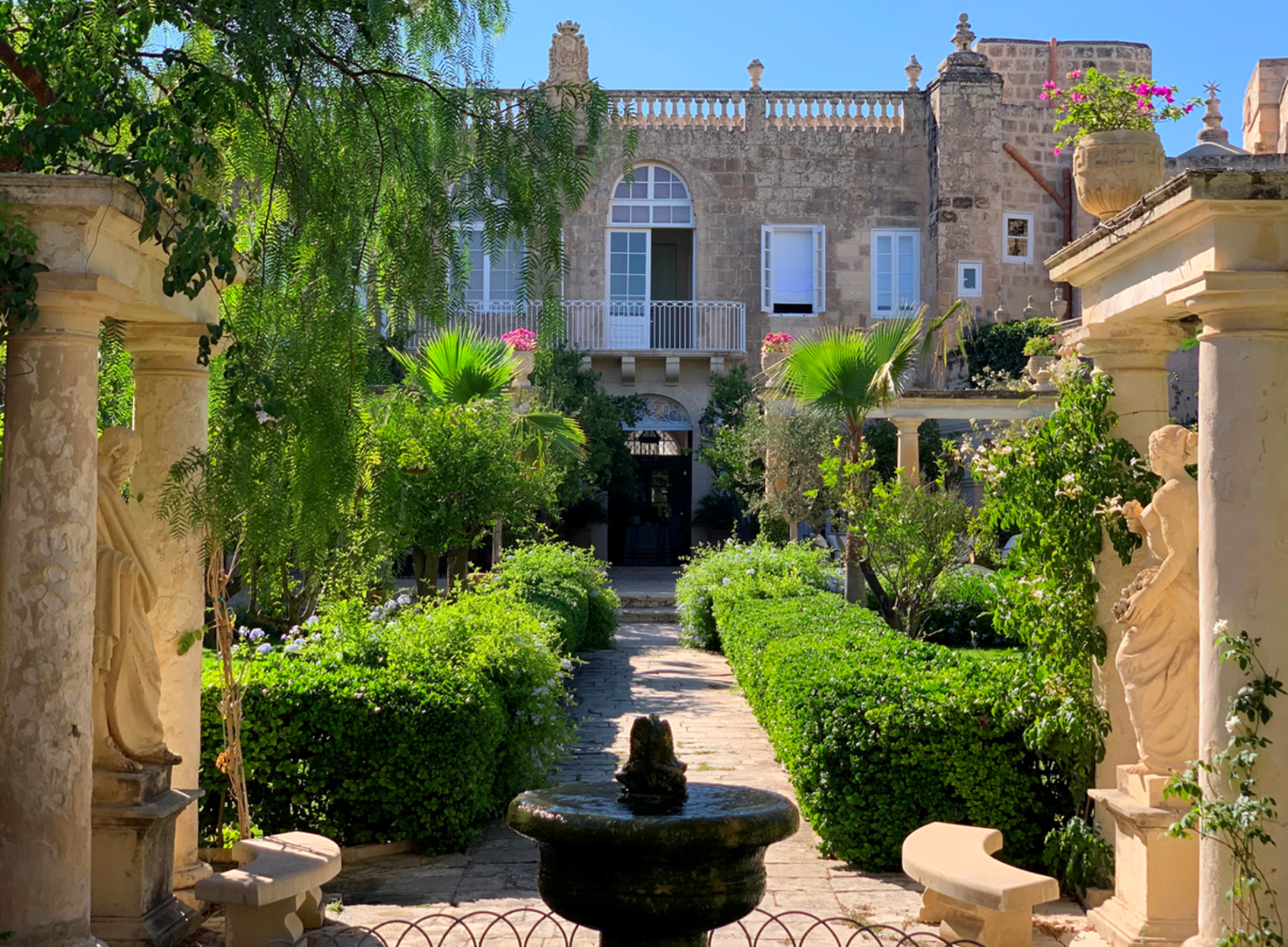 Ornate gardens and entrance to Casa Bonavita hotel Attard Malta