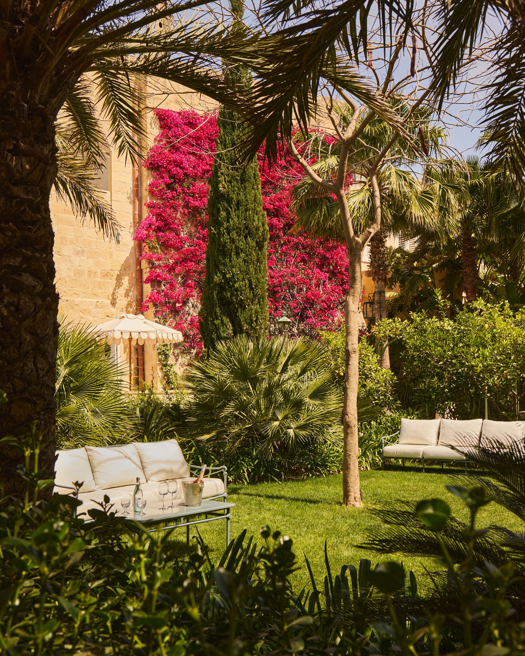 Outdoor seating in the gardens of Casa Bonavita hotel in Attard Malta