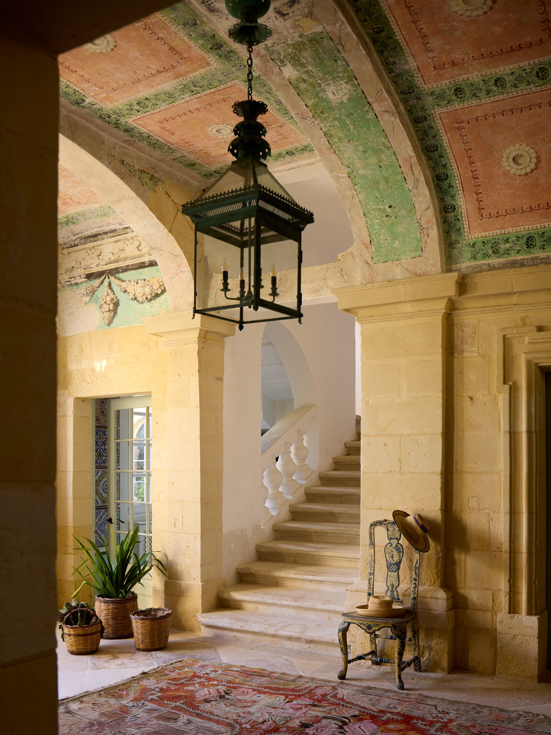 Lantern and staircase in a hallway of Casa Bonavita hotel Attard Malta