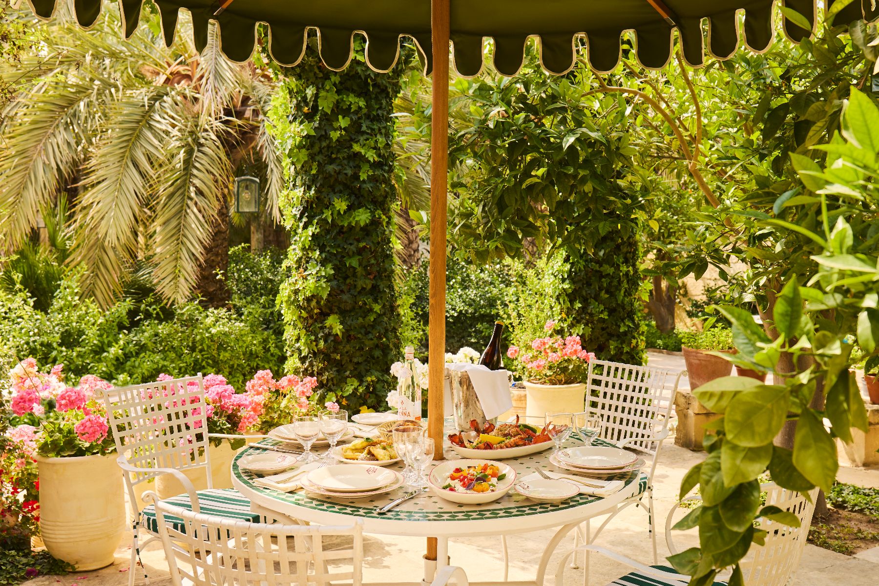 Table set for lunch in the gardens of Casa Bonavita hotel in Attard Malta