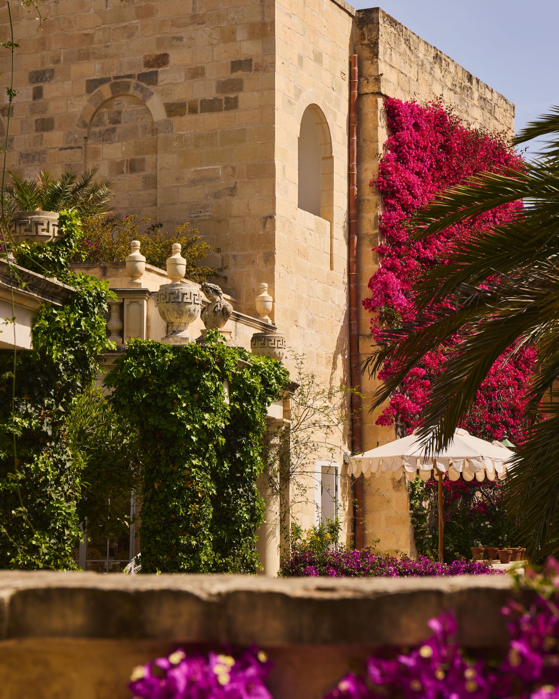 Bougainvillea filled gardens and terrace at Casa Bonavita hotel in Attard Malta