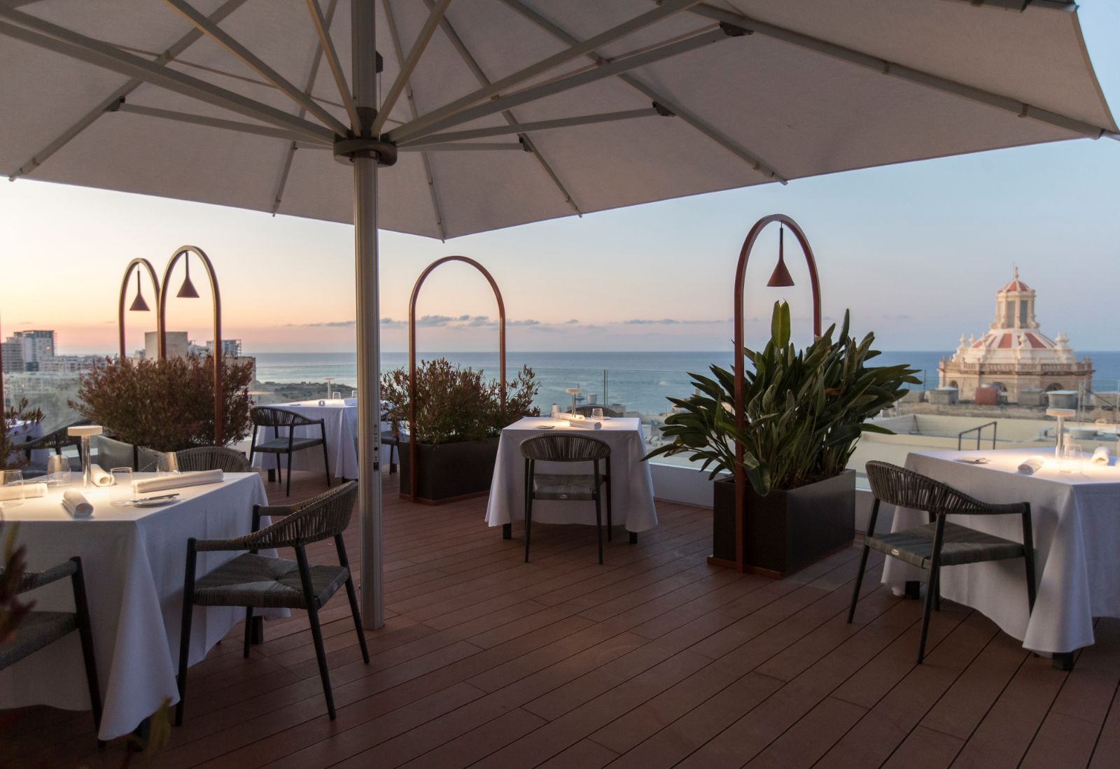 Rooftop terrace of the Over Grain cocktail lounge at the Rosselli AX Privilege Hotel in Valletta Malta