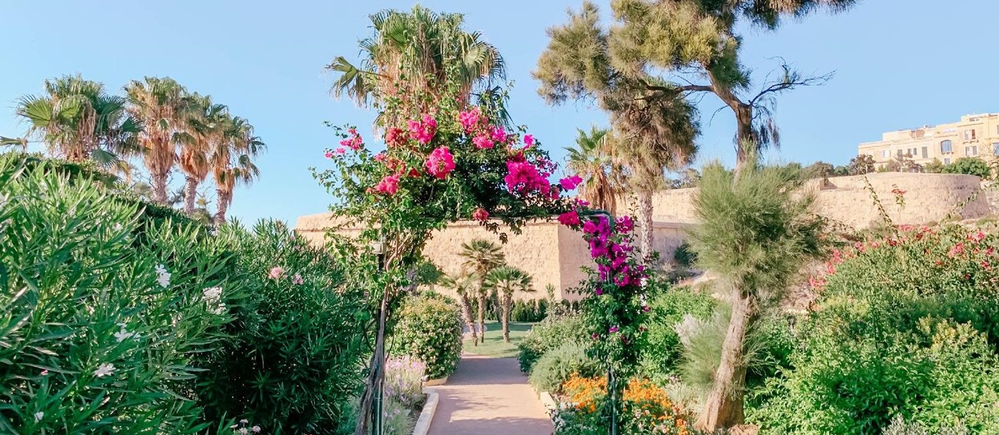 Flower filled gardens of The Phoenica Malta hotel in Valletta