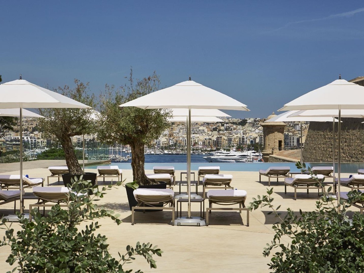 Pool and sun terrace at The Phoenica Malta hotel in Valletta