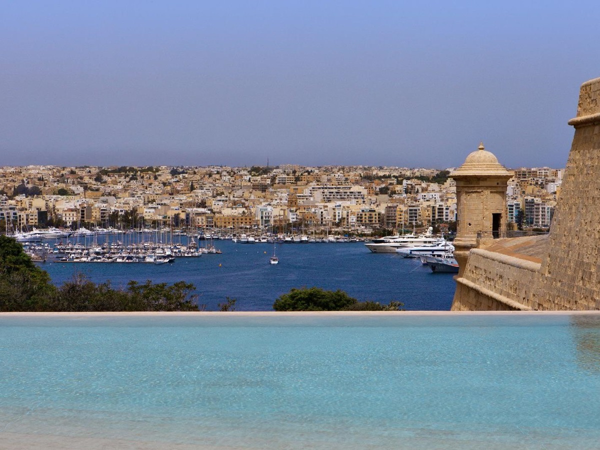 Bastion and harbour views from the infinity pool at The Phoenica Malta hotel in Valletta