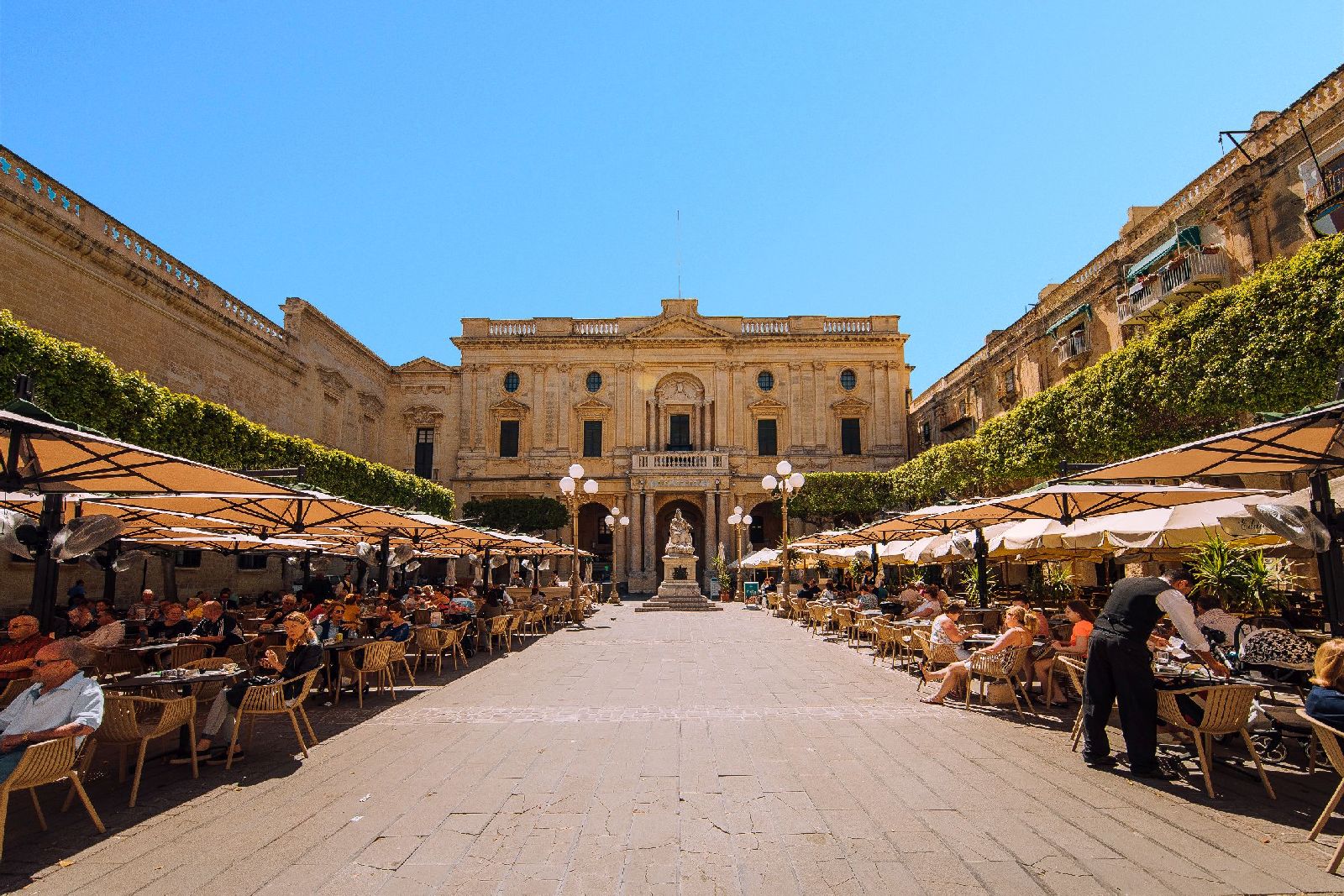 Pavement cafes and the National Library in Valletta, Malta