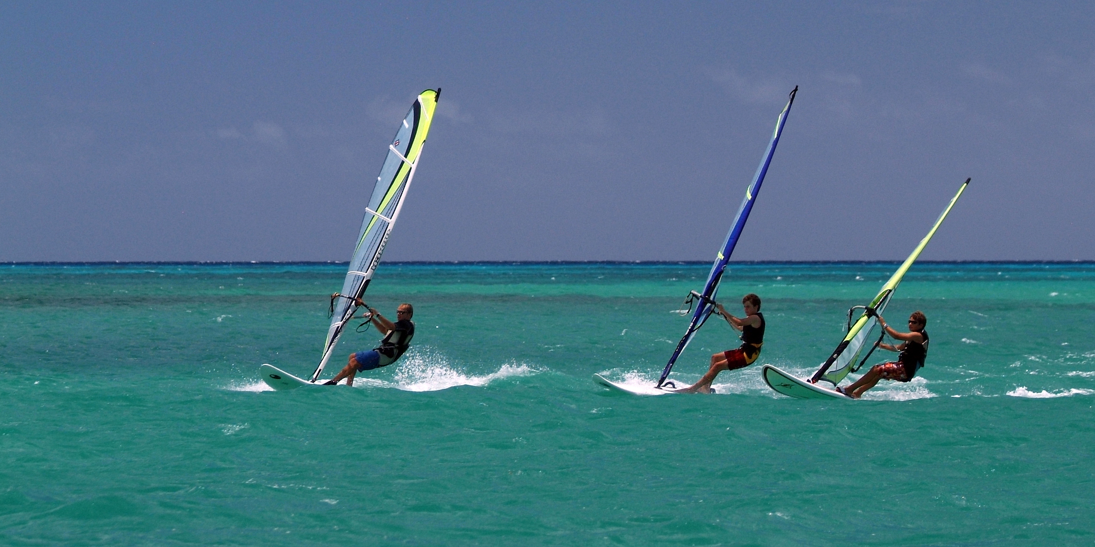 Three windsurfers near 20 Degrees South, Mauritius