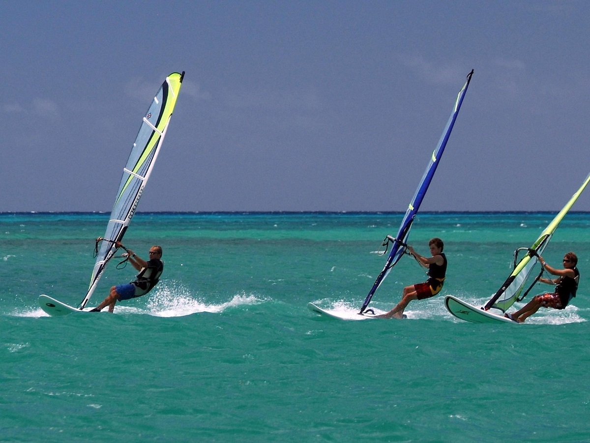Three windsurfers near 20 Degrees South, Mauritius