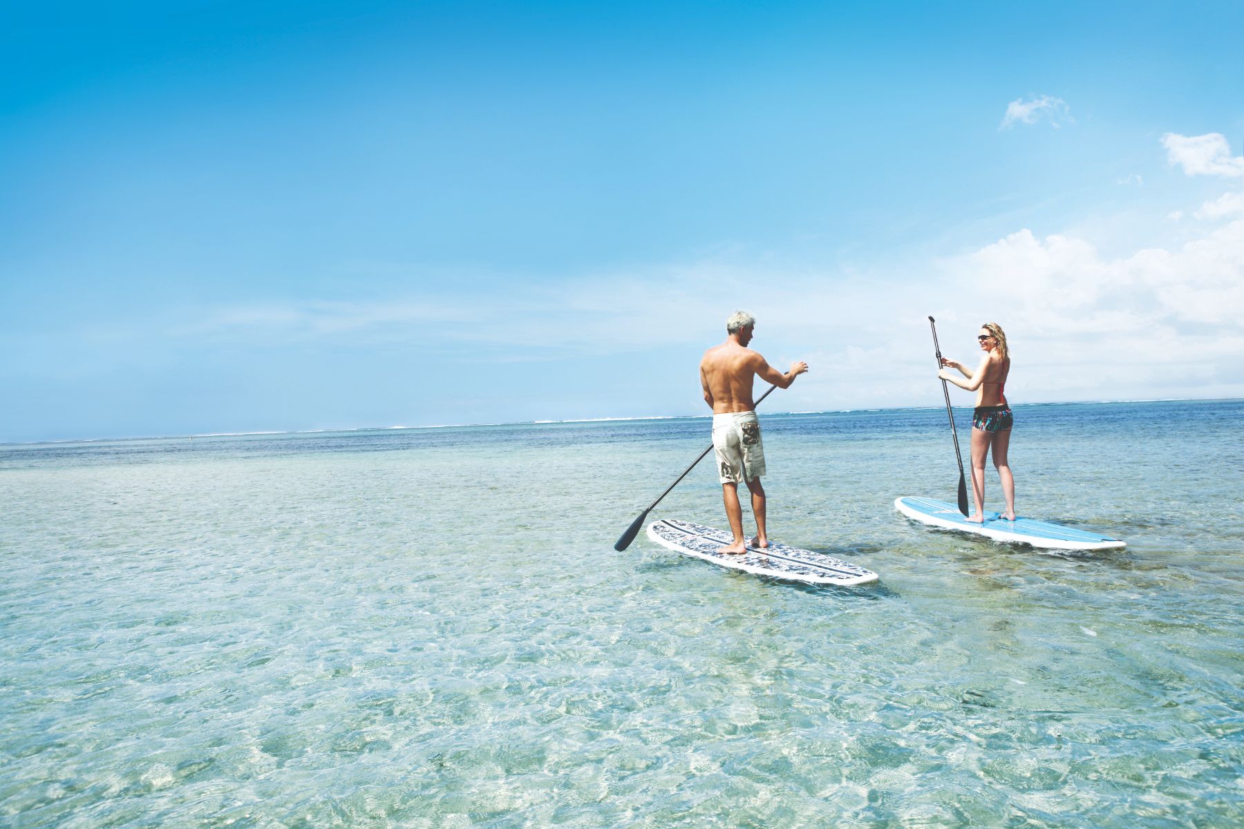 Stand up paddleboarding a Heritage Le Telfair Golf & Wellness Resort in Mauritius