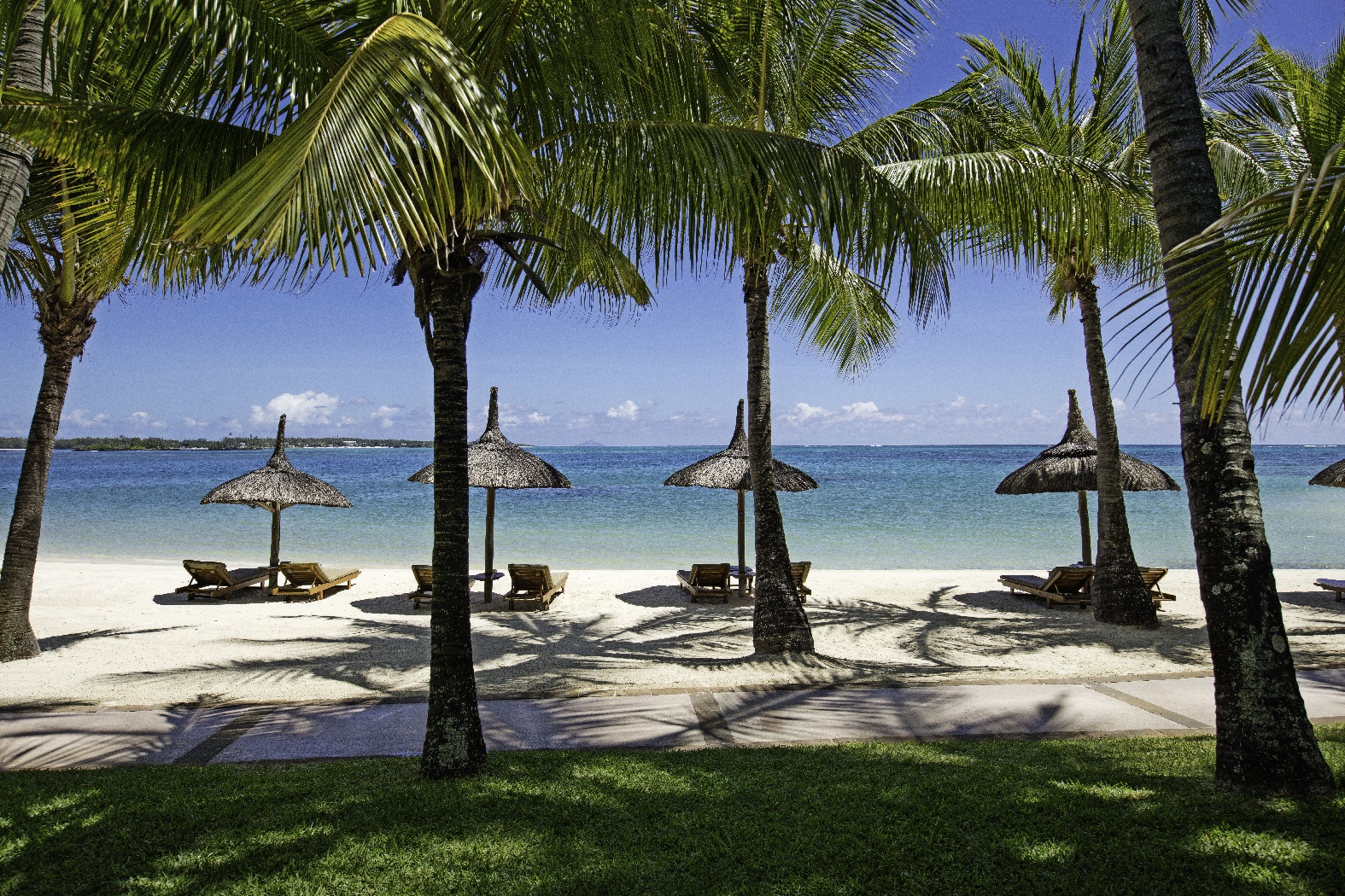 beachfront and parasols at COMO Le Saint Geran, Mauritius