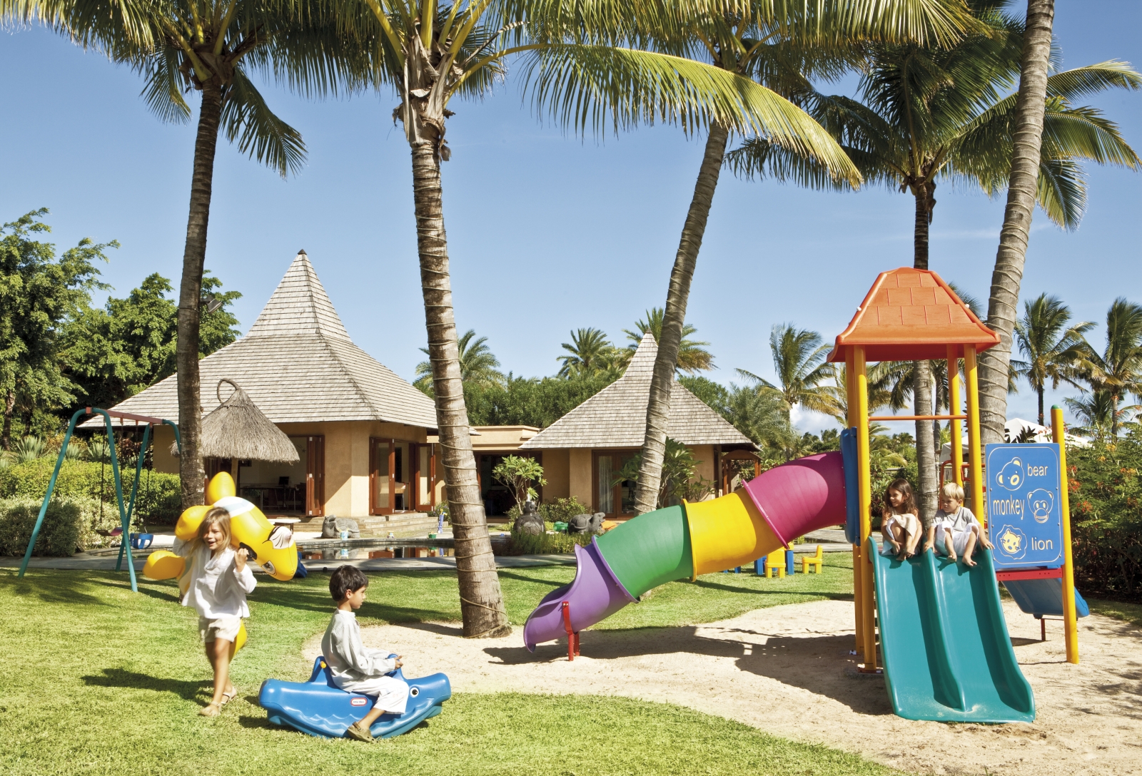 Kids playing on a playground at the Shanti Maurice playground