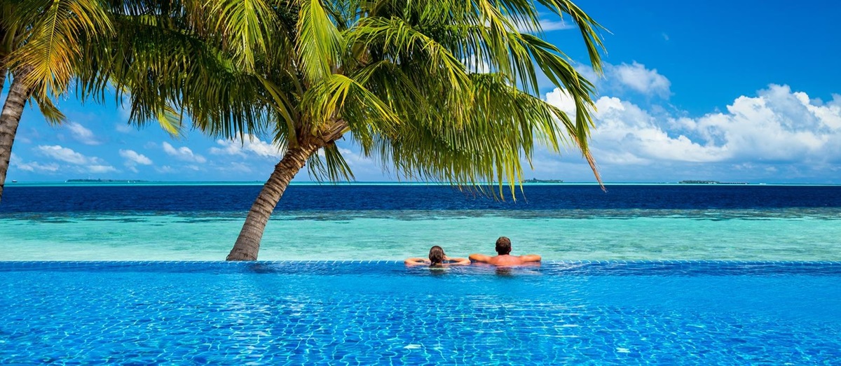 An infinity pool with two palm trees in Mauritius
