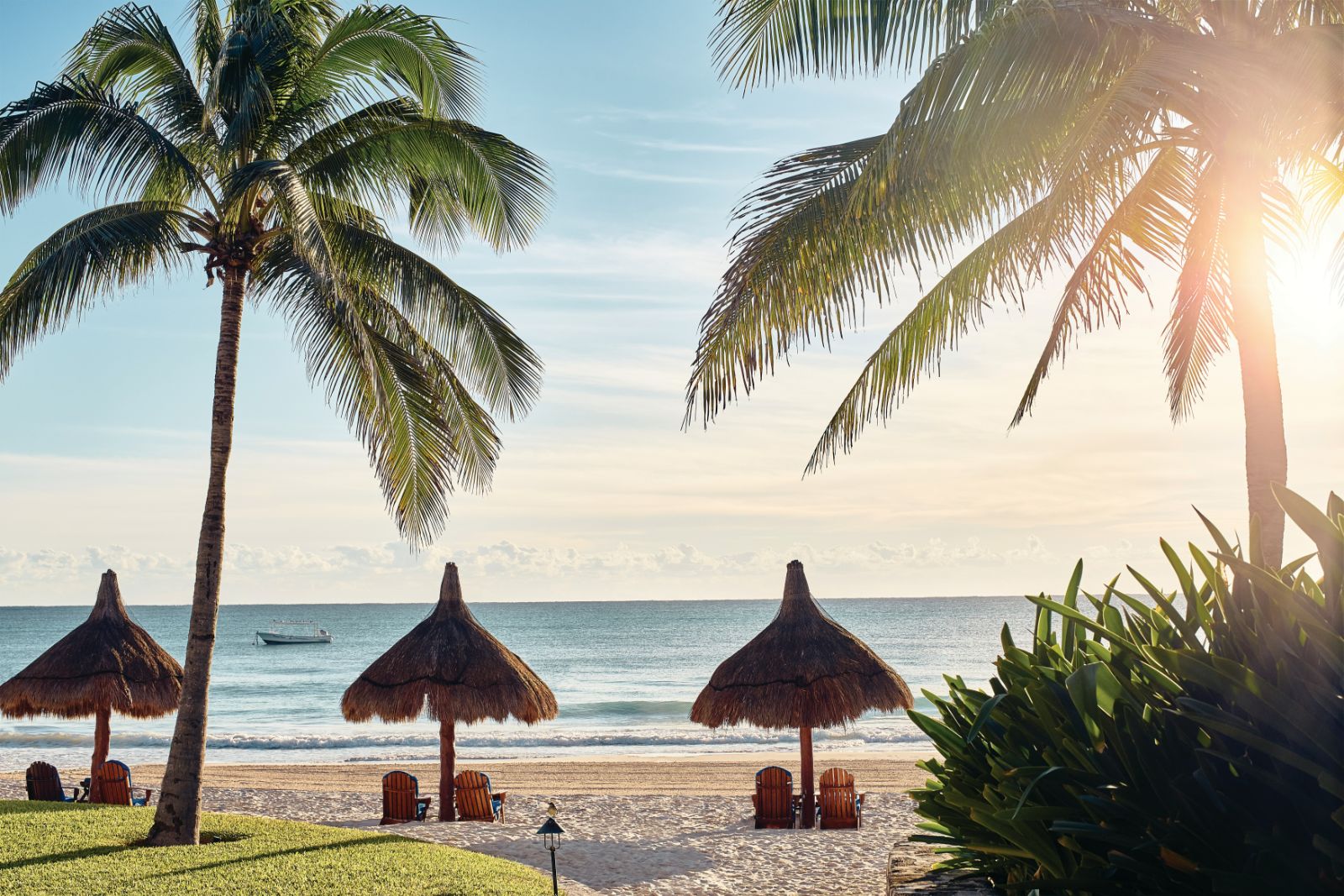 Loungers on the palm fringed beach at Belmond Maroma in Mexico