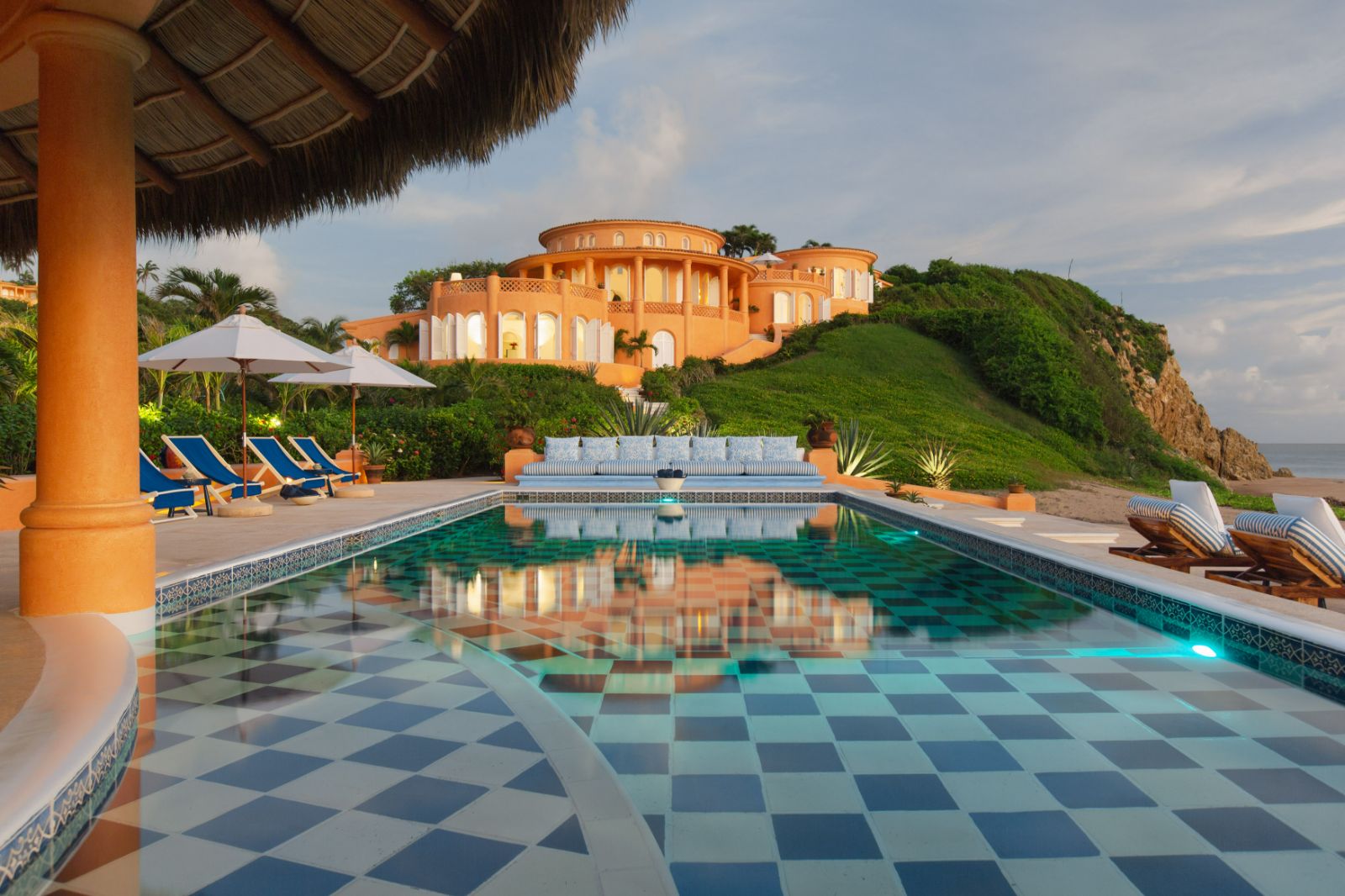 Pool view with exterior of Cuixmala on Mexico's Pacific coast