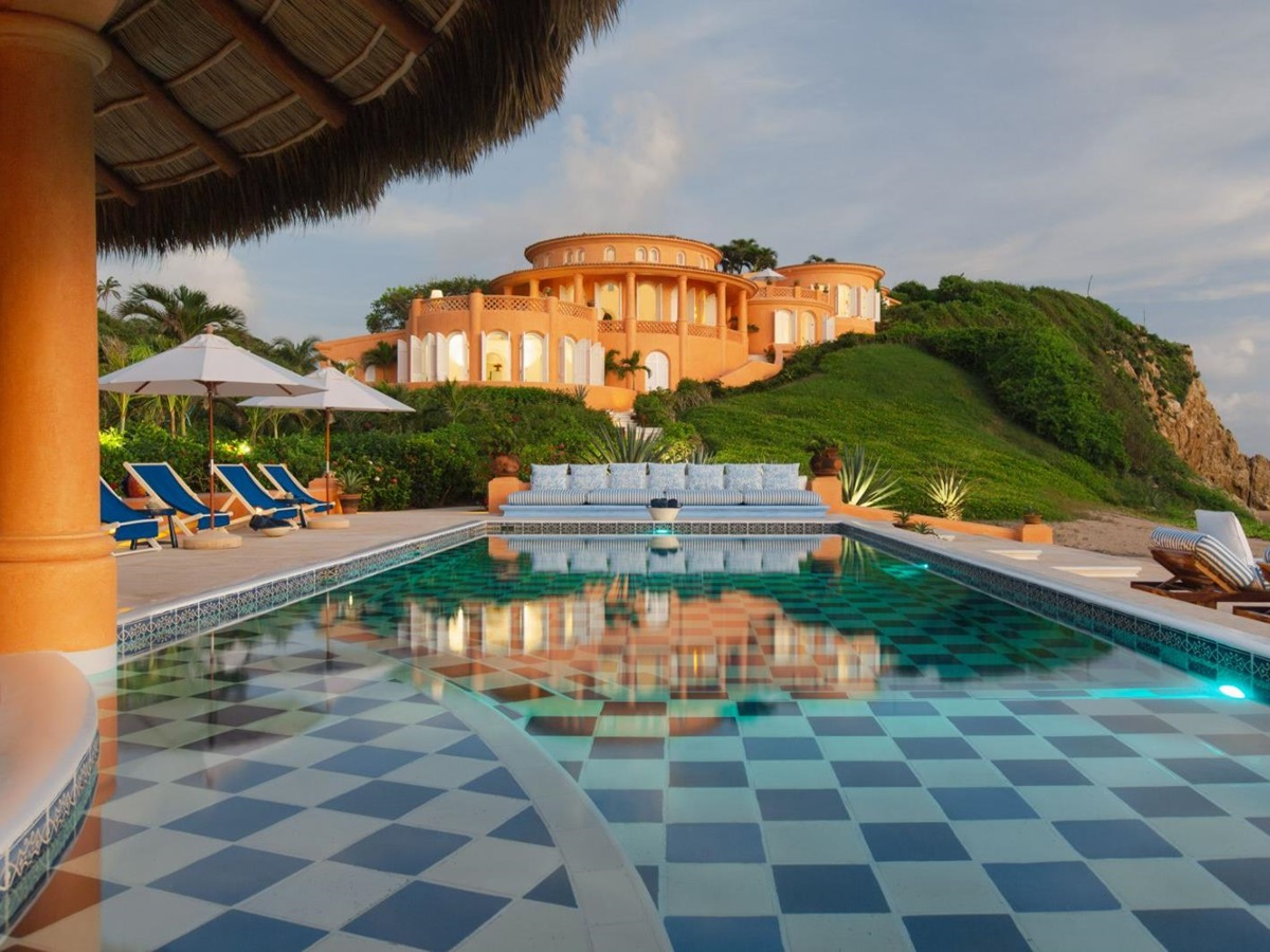 Pool view with exterior of Cuixmala on Mexico's Pacific coast
