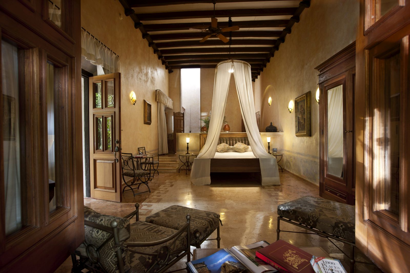 A spacious bedroom with high ceilings at the hotel Hacienda Xcanatun in Mexico