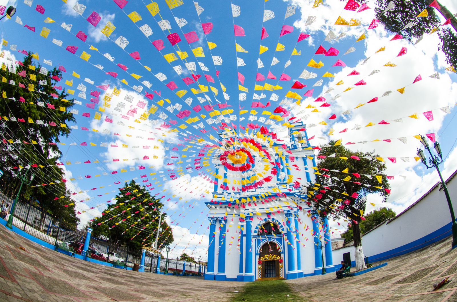 Flags outside San Cristobal church in Mexico