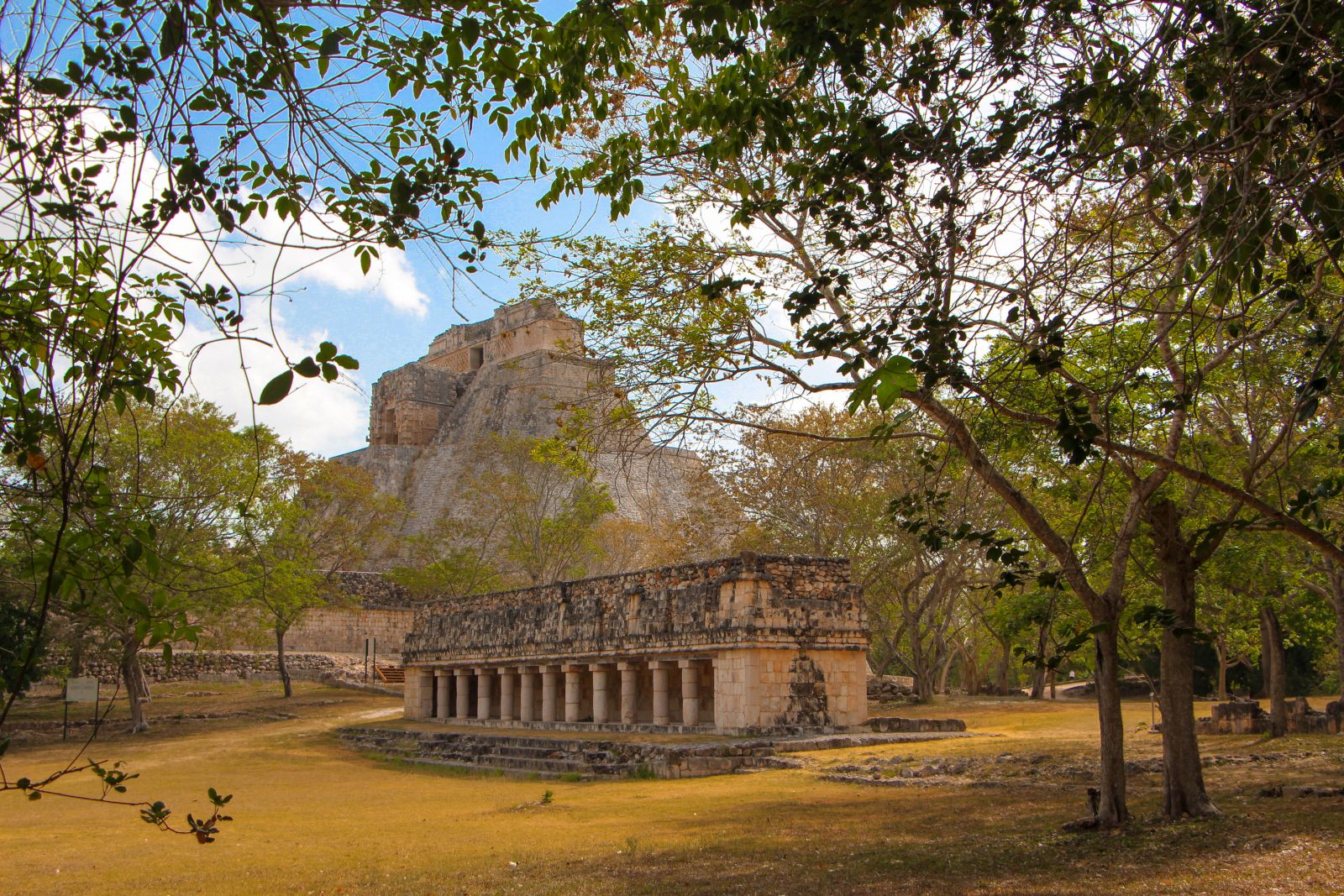 A temple at the ancient Mayan town of Uxmal with the hills of Puuc in the background