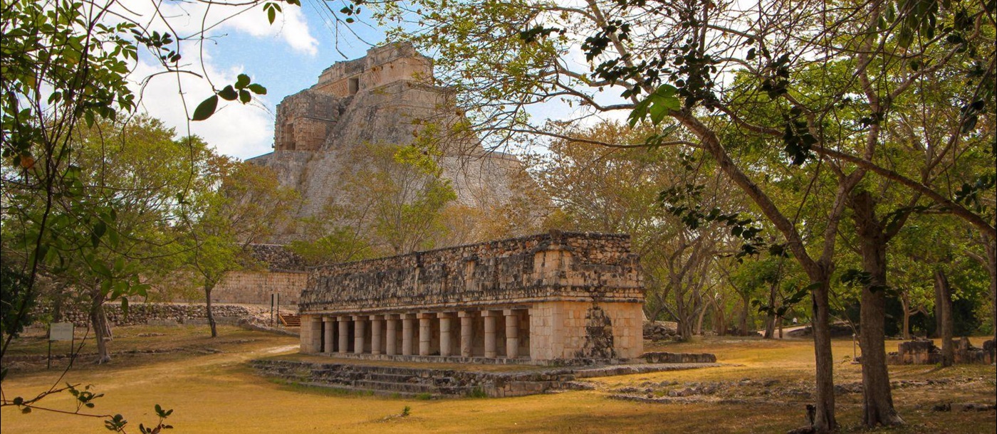 A temple at the ancient Mayan town of Uxmal with the hills of Puuc in the background