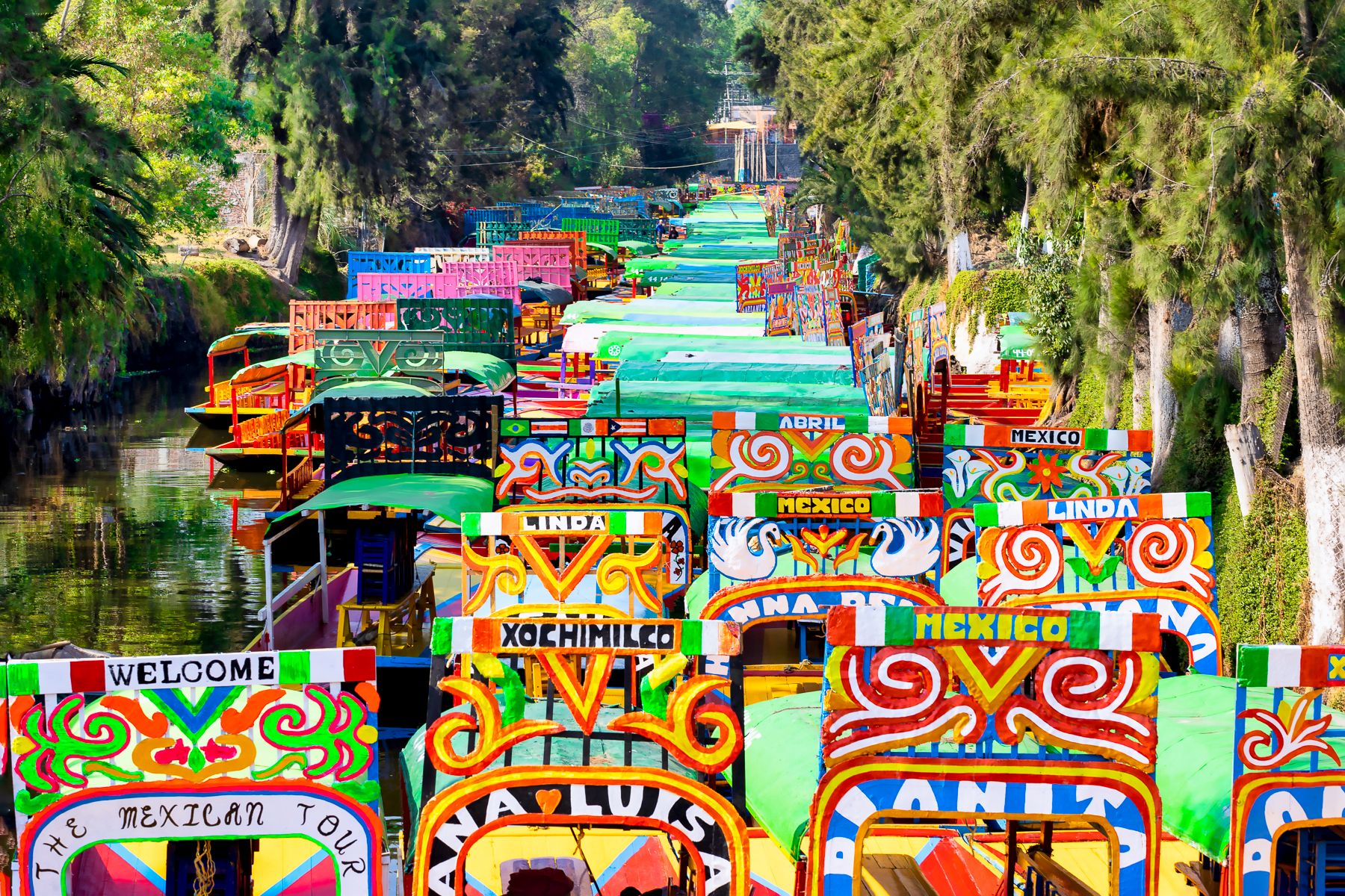 Colourful boats on the river in Xochimilco