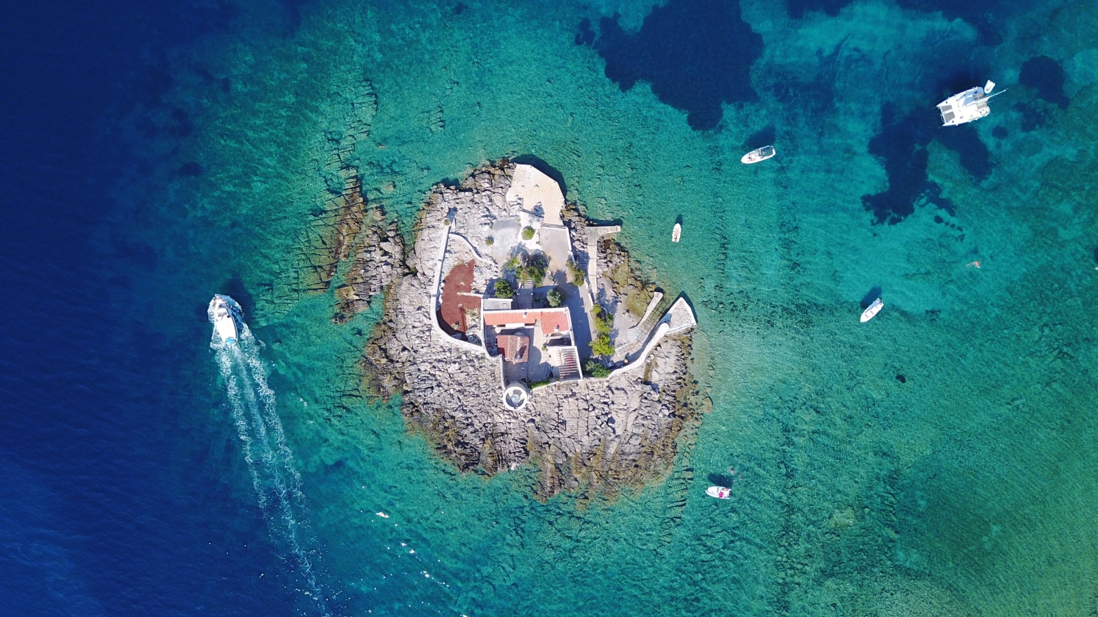 Aerial shot of Azra Fortress surrounded by the turquoise waters of the Mediterranean Sea
