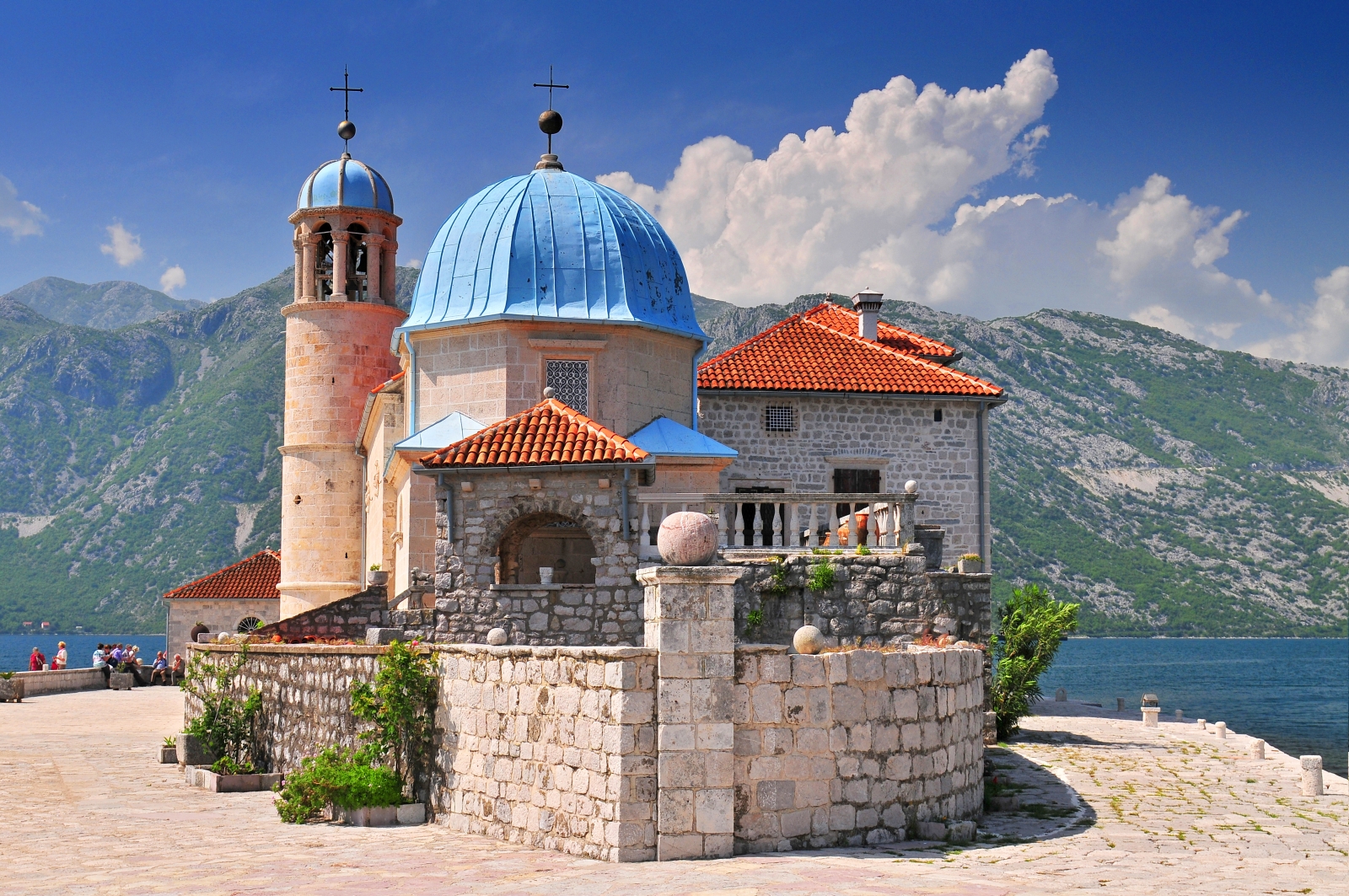 Church Our Lady of the Rocks on a hill overlooking the Mediterranean Sea and mountains of Montenegro