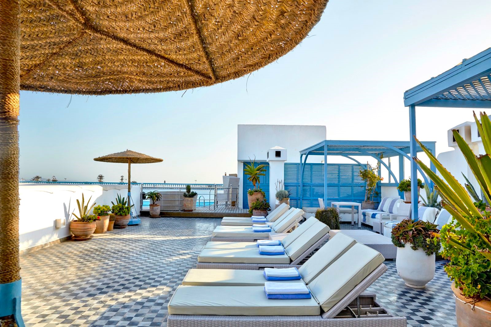 Terrace by the pool at Heure Bleue Palais luxury hotel in Essaouira