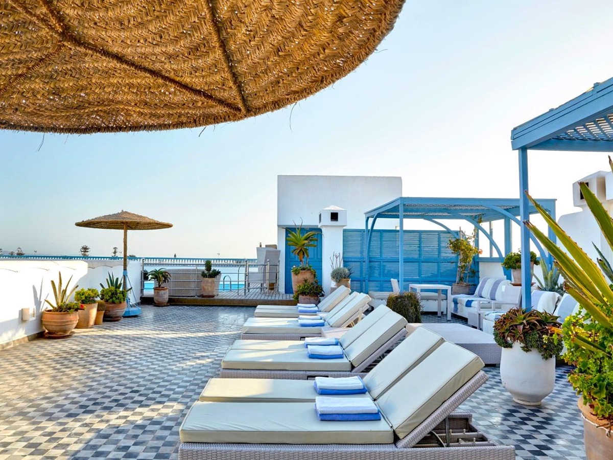 Terrace by the pool at Heure Bleue Palais luxury hotel in Essaouira