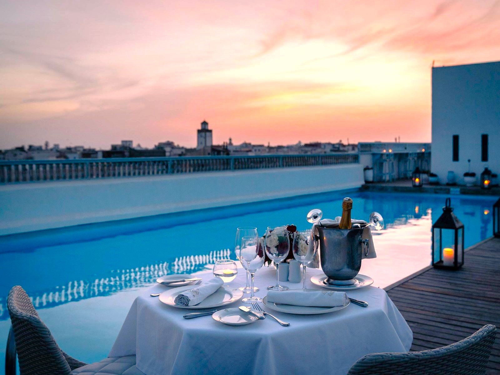 Poolside dining at Heure Bleue Palais luxury hotel in Essaouira