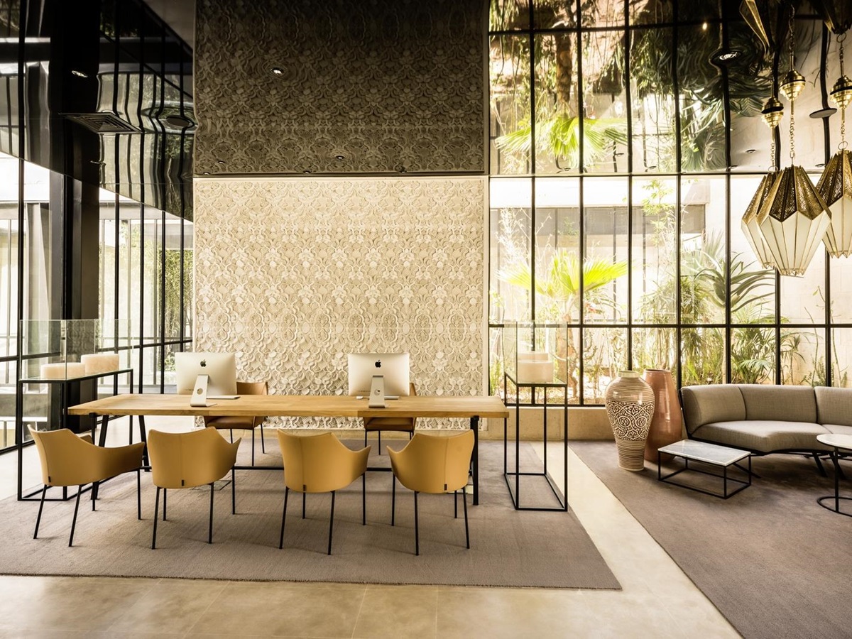 Stylish open workspace at Hotel Sahrai equipped with Mac Books